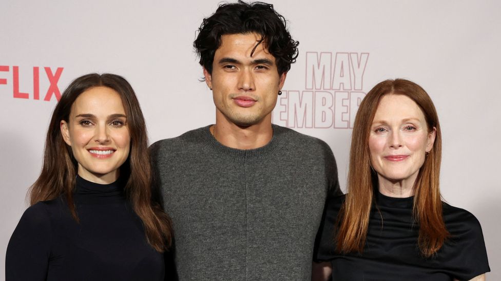 Cast members Natalie Portman, Charles Melton and Julianne Moore attend a photo call for the film "May December" in Los Angeles, California,