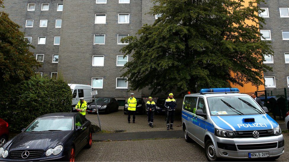 Police officers at a residential building where the bodies of five children were found in the western town of Solingen, Germany, 3 September 2020