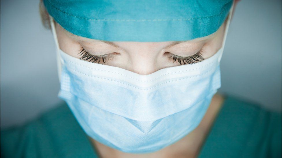 Nurse looking down - stock photo