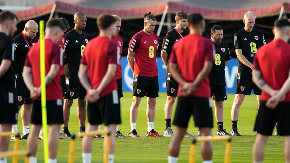 Wales players hold a minute silence at their training camp for Gary Speed