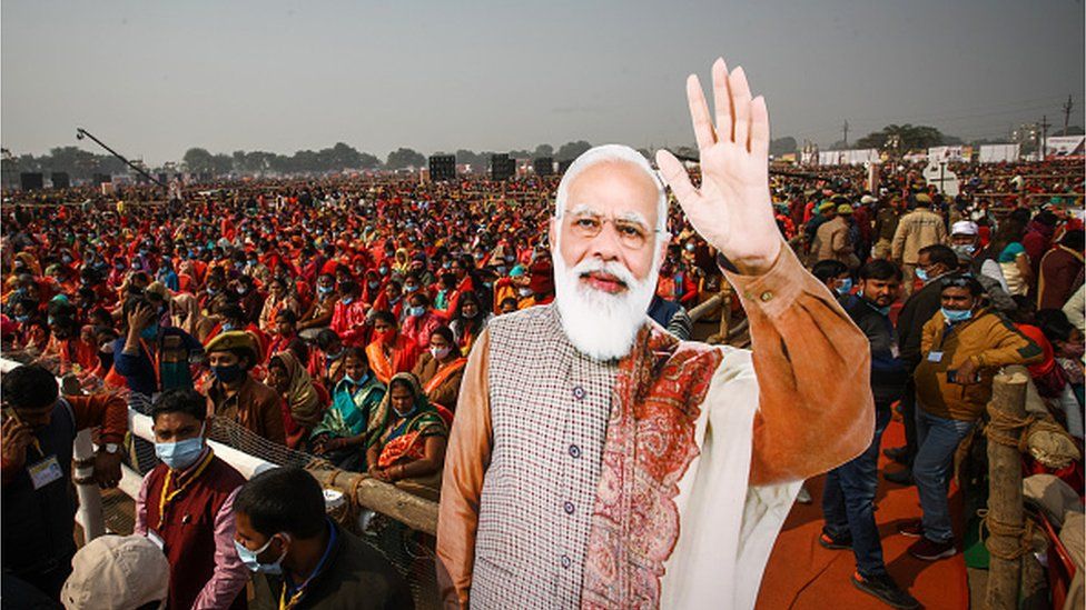 Women from various districts are seen near cut-outs of India's Prime Minister Narendra Modi at a rally held by Modi on December 21, 2021 in Allahabad, India.