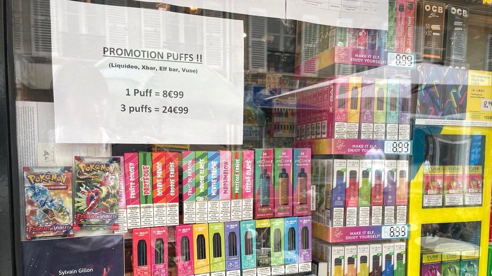 Shop window filled with boxes of disposable vapes