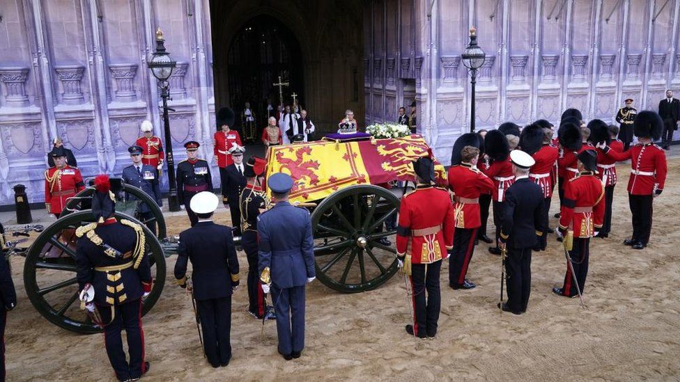 The bearer party prepare to carry the coffin of Queen Elizabeth II into Westminster Hall, London