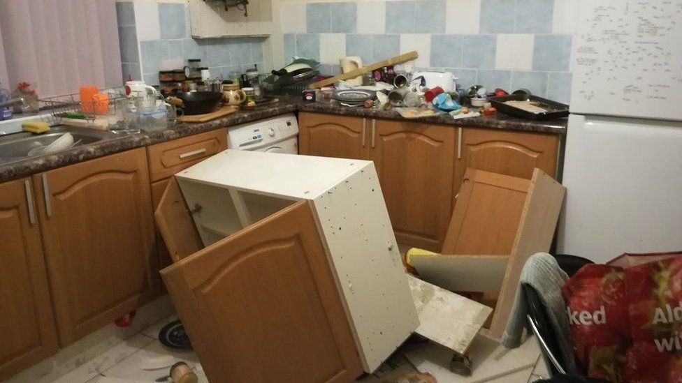 Kitchen unit having fallen off a wall in a HMO