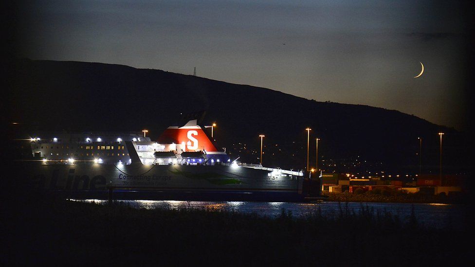 The Superfast VIII ship docked in Belfast on Monday evening, pictured with a thin crescent moon in the sky behind it