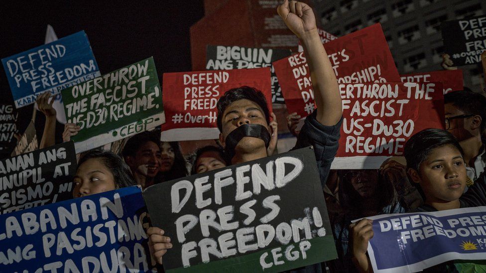 Journalists and activists stage a protest calling to defend press freedom on January 19, 2018