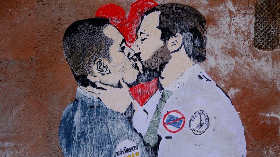 A mural depicting Northern League"s leader Matteo Salvini (R) and 5-Star Movement leader Luigi Di Maio kissing is seen in Rome,