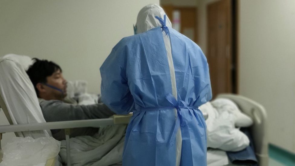 Hospital bed with patient