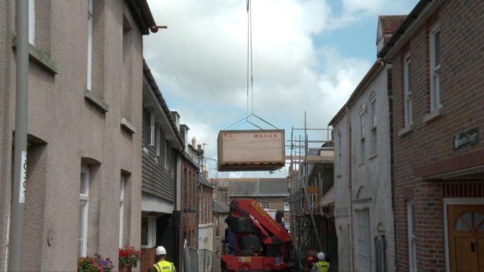 Crane lifting artefacts into Dorset Museum