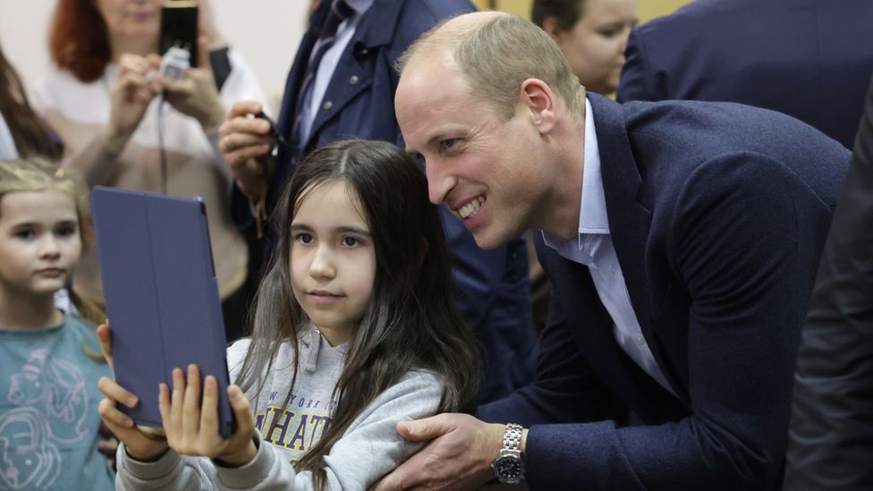 Prince William takes a selfie with a girl