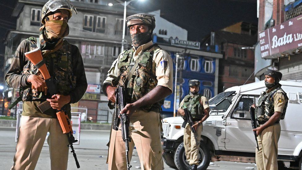Indian paramilitary troopers stand guard at a roadblock at Maisuma locality in Srinagar on August 4, 2019.