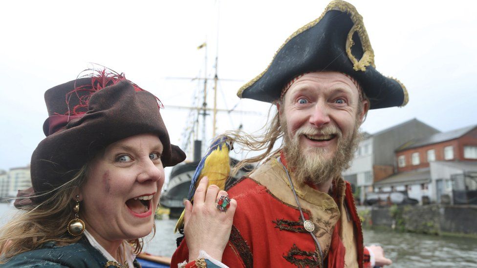 Street performers dressed as pirates on the streets around Bristol's Harbourside