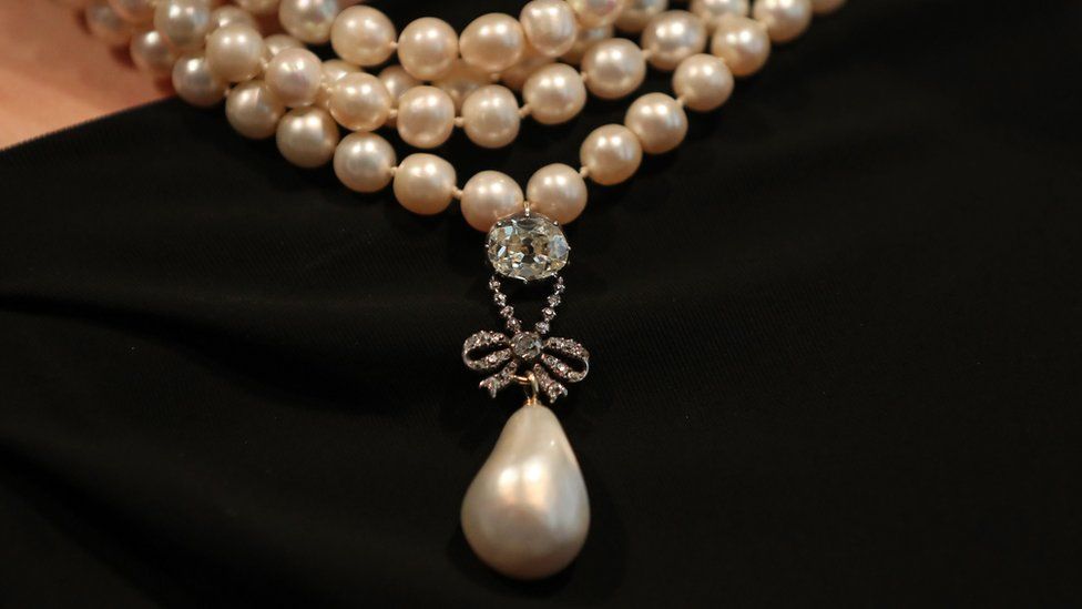 Marie Antoinette's pendant and pearl necklace modelled ahead of the auction in Geneva on 14 November 2018
