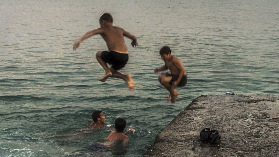 A group of boys swimming at the Black Sea in Abkhazia