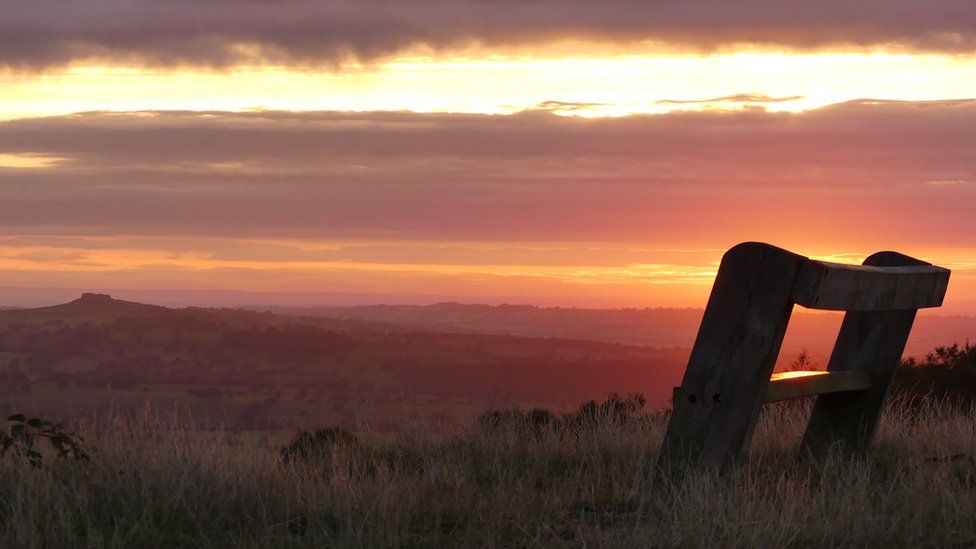 The sun rising over Otley Chevin in Leeds