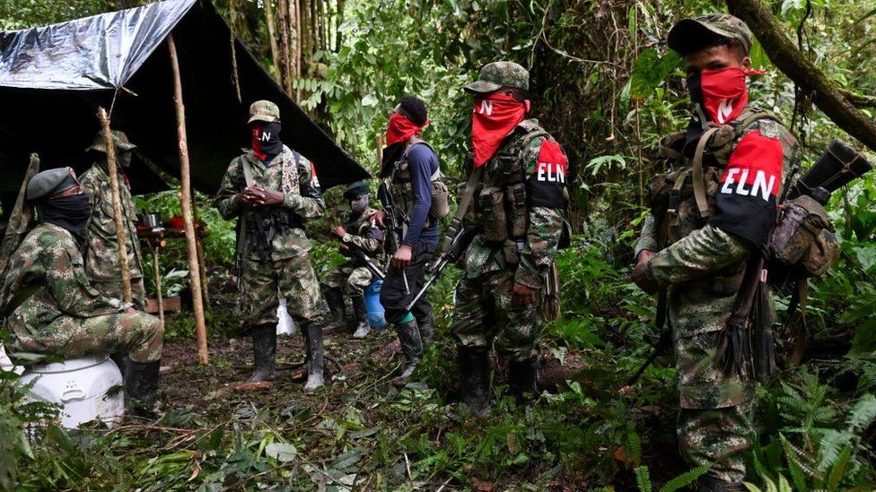 ELN guerrillas stand at an improvised camp in the Choco jungle, Colombia, in 2019