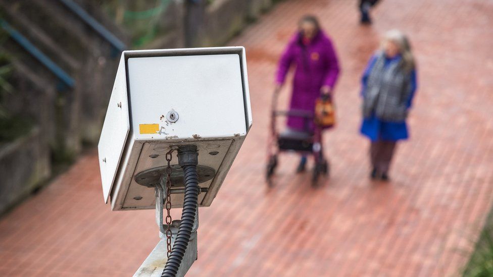 A security camera watching a street