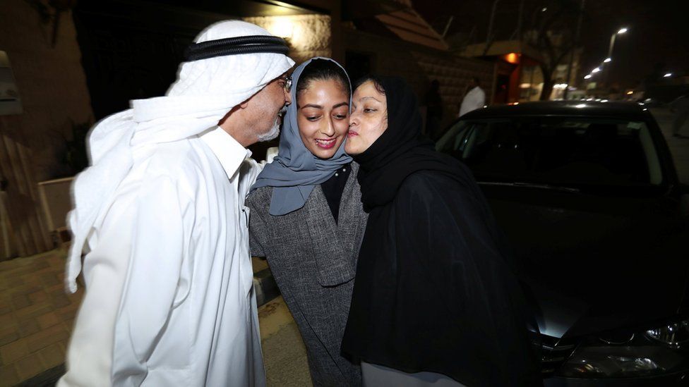 Hannan Iskandar is kissed by her parents, after she drove her car in her neighborhood, in Al Khobar, Saudi Arabia,