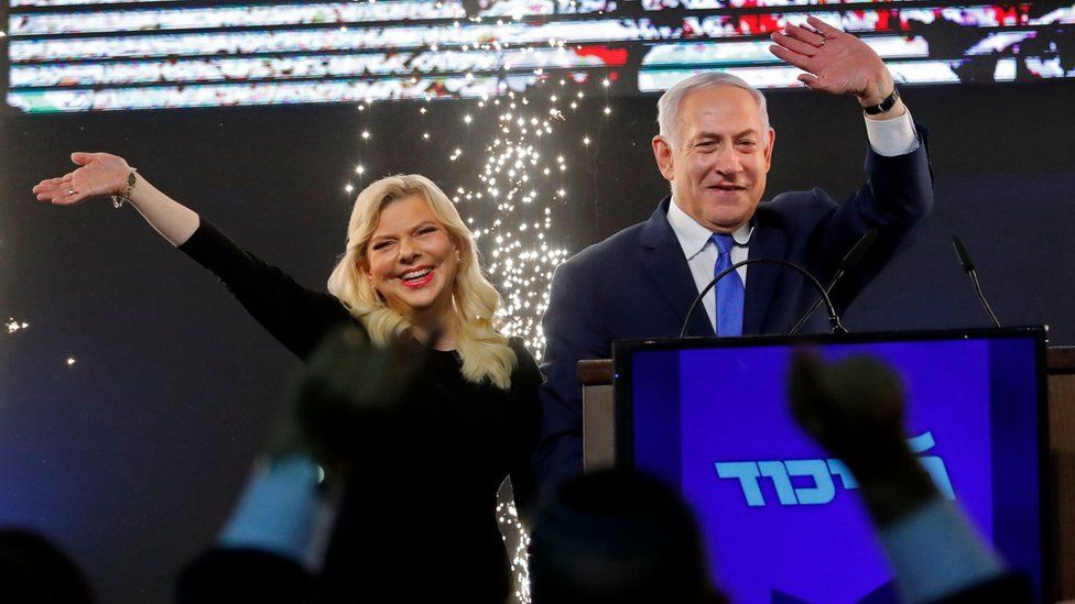 Benjamin Netanyahu and his wife Sara greet Likud supporters at the party's headquarters in Tel Aviv on 10 April 2019