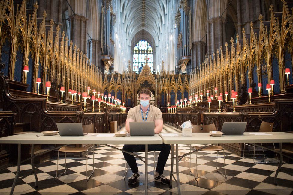Staff wait for patients at a new Covid-19 vaccination site in Westminster Abbey, London. 10 March 2021