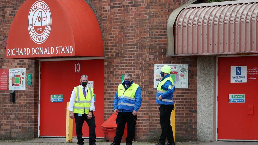 Stewards outside Aberdeen's Pittodrie Stadium