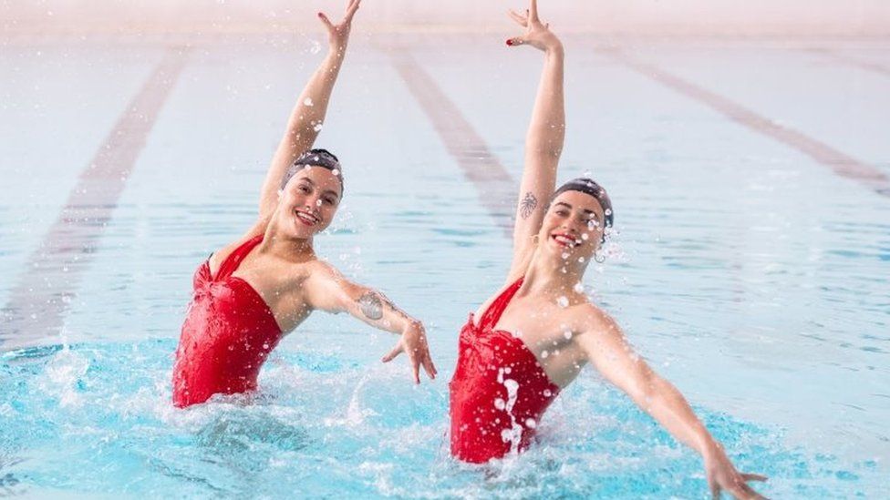 Rebecca Richardson (left) and Genevieve Florence, members of the Aquabatix synchronised swimming team during a practice session in the swimming pool at Clissold Leisure Centre, north London, which has reopened to the public