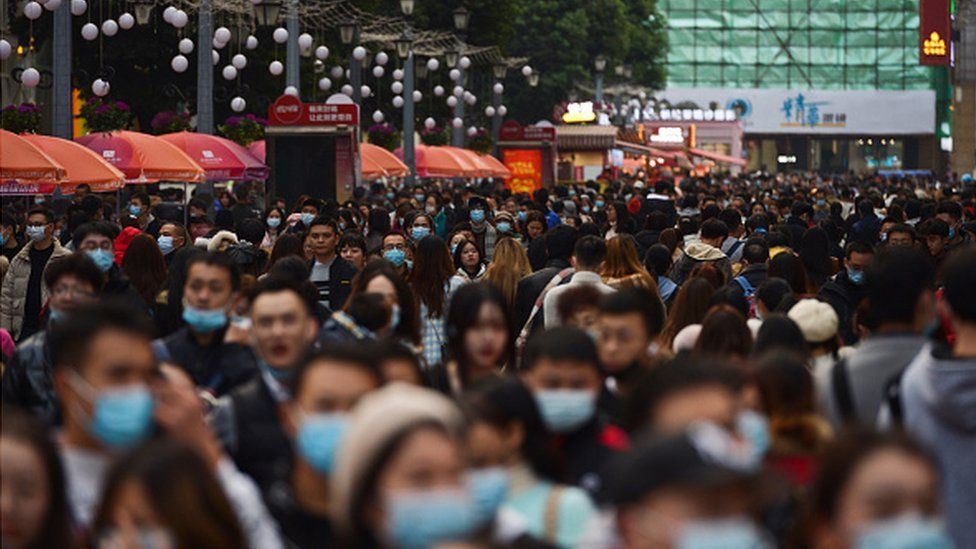 Pedestrians walk in Chengdu, China