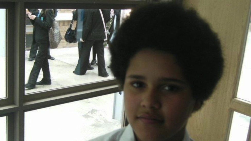 Jarrakeh as a child with an afro