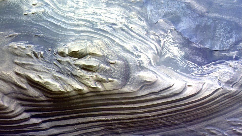 Layered sediments on a mound in Juventae Chasma, just north of Valles Marineris