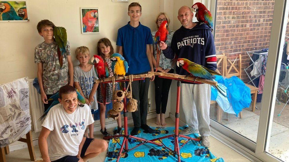 The Gosden family and their parrots
