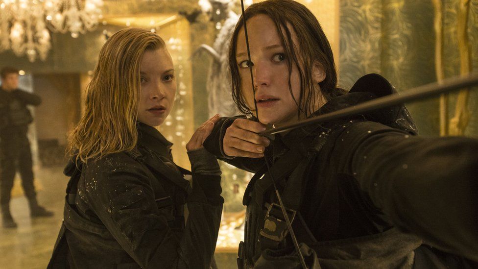 Jennifer Lawrence as Katniss (right) with Natalie Dormer as Cressida in Mockingjay - Part 2