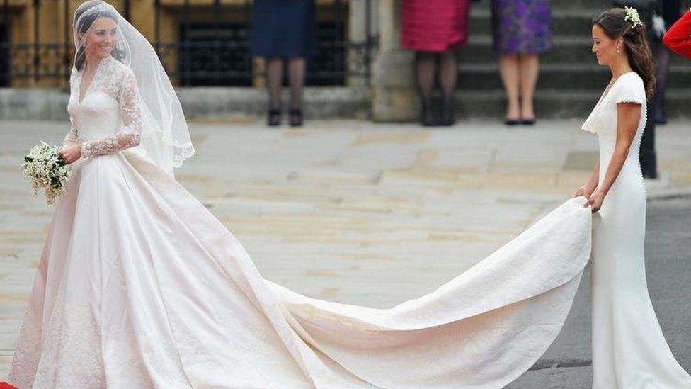 Pippa Middleton holding the wedding dress of her sister, the Duchess of Cambridge