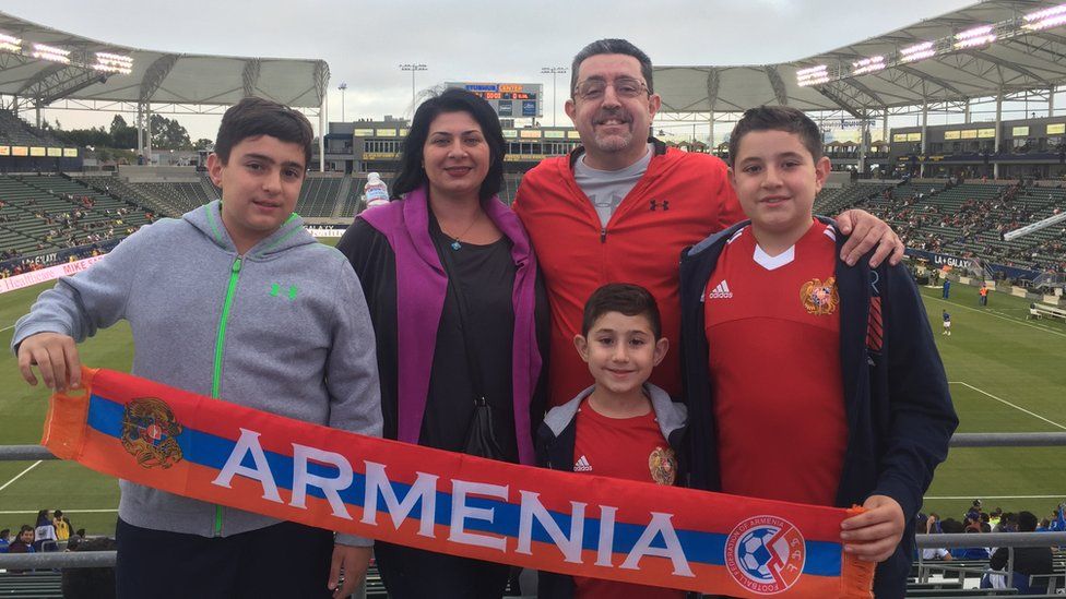 Sylvie and John Chatikachian pose with their family before the Armenia v El Salvador football match