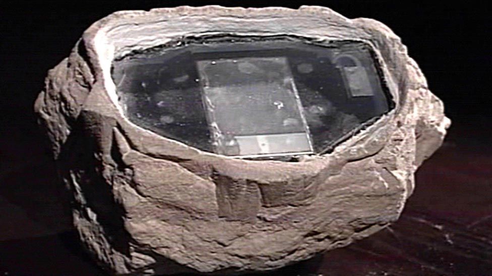 Image from Russian television shows electronic equipment concealed in a rock.
