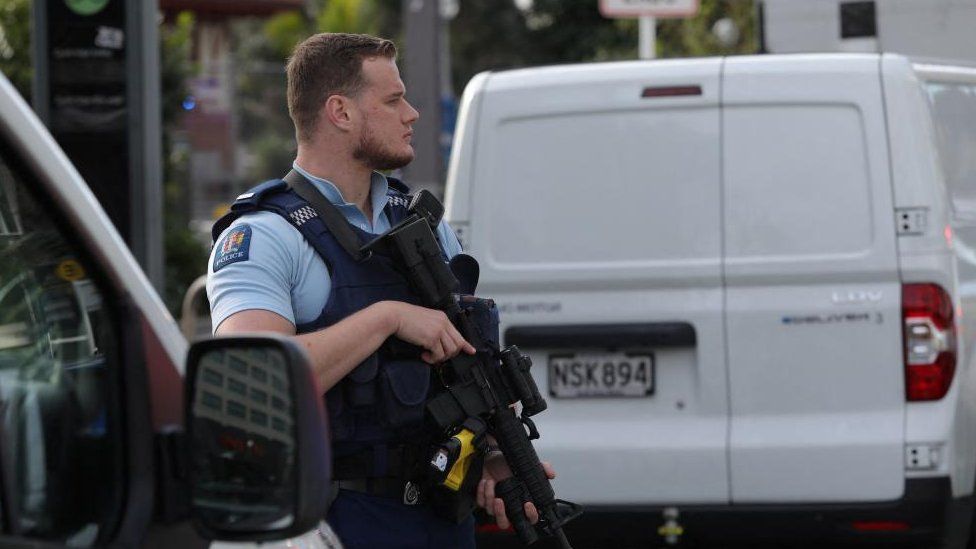 A police officer stands guard amid reports of a shooting in Auckland, New Zealand on July 20, 2023