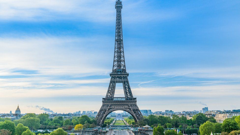 Eiffel tower, gardens nearby, Paris skyline