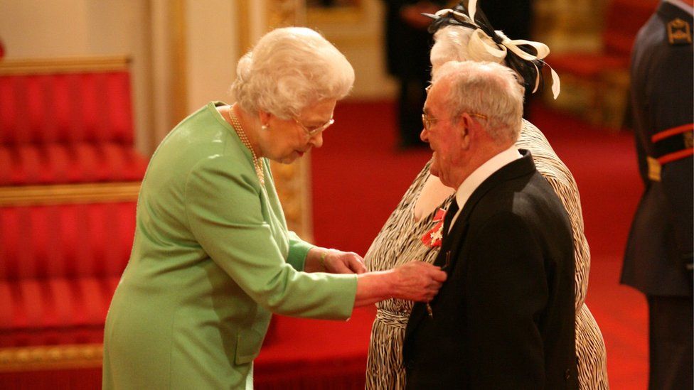 Penelope Jones and Ronald Jones as they receive their MBEs from the Queen