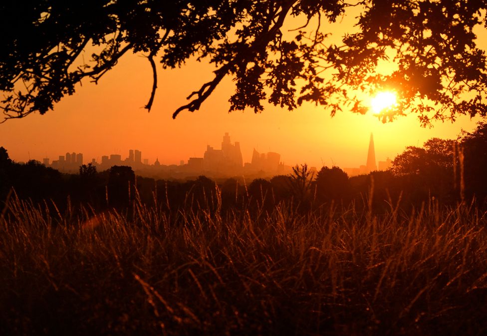 The sun rises above the London skyline, as a second heatwave is predicted for parts of the country, in London, Britain, 11 August 2022.
