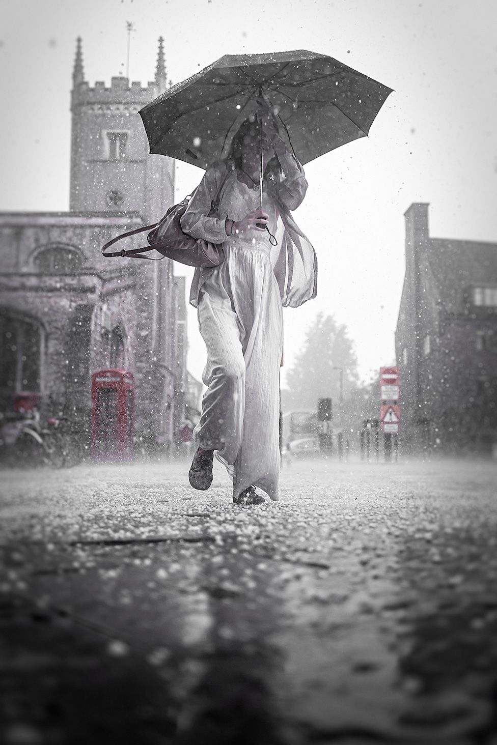 Woman with an umbrella in Cambridge