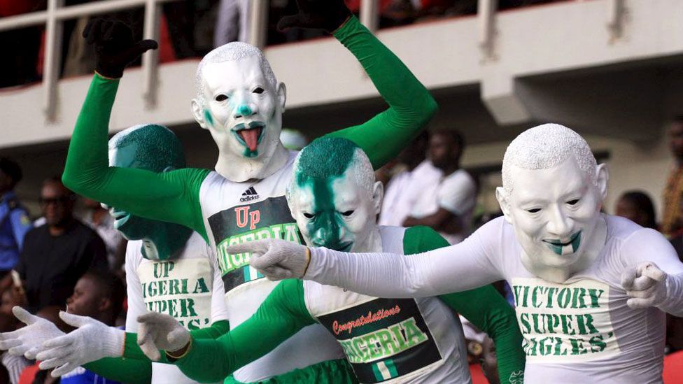 Masked Nigerian football fans in Port Harcourt, Nigeria - Tuesday 17 November 2015