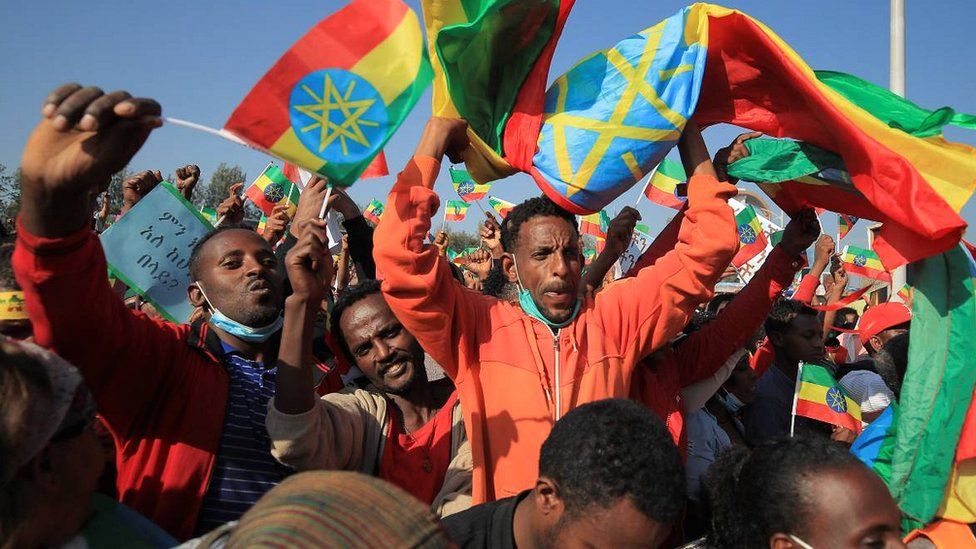 Supporters of the government waving flags at a rally in Addis Ababa