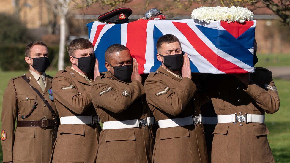Members of the Yorkshire Regiment carry Captain Sir Tom Moore's coffin
