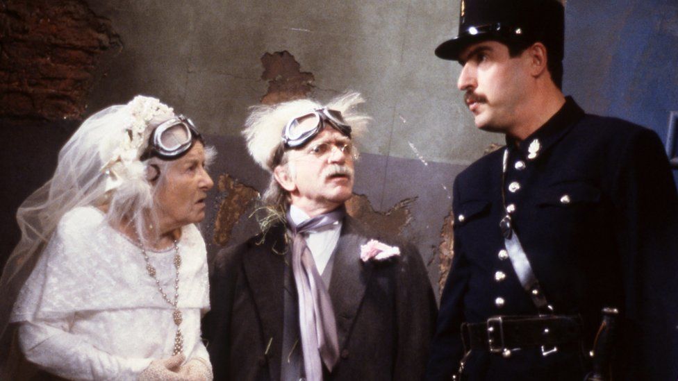 Rose Hill as Madame Fanny La Fan, Robin Parkinson as Ernest Leclerc and Arthur Bostrom as Officer Crabtree in Allo Allo!