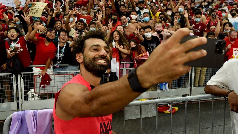 Liverpool's Mohamed Salah takes a selfie during the pre-season friendly between Liverpool v Crystal Palace at Singapore's National Stadium.