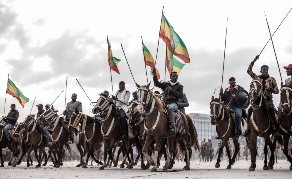 Horse riders wave the Ethiopian national flag during a rally in Addis Ababa, Ethiopia - Sunday 8 August 2021