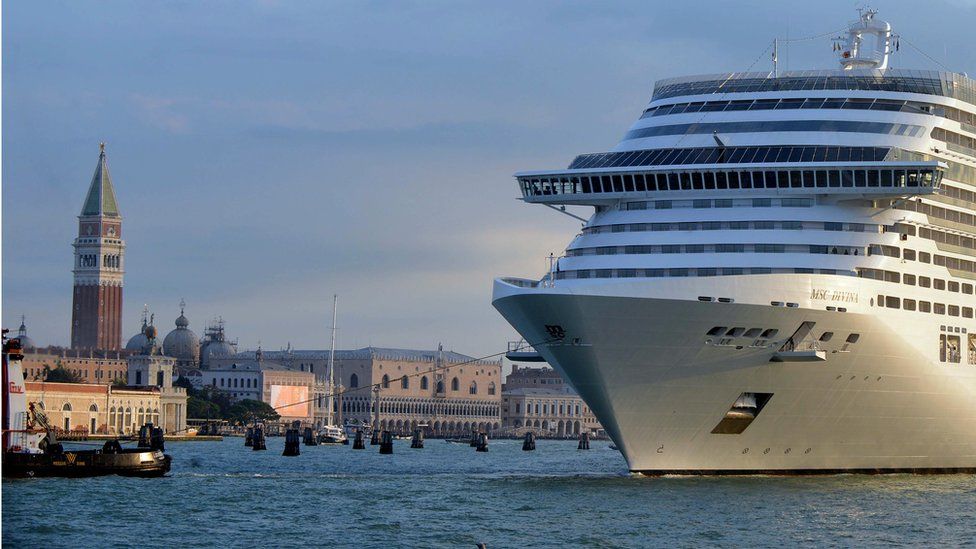 A giant cruise ship arrives in front of Saint-Mark's square in Venice on September 21, 2013