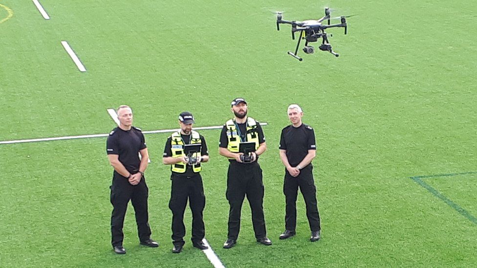 Police officers with drone