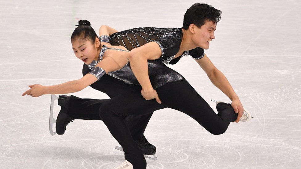 Kim Ju Sik and Ryom Tae Ok compete in the pair skating short program of the figure skating event