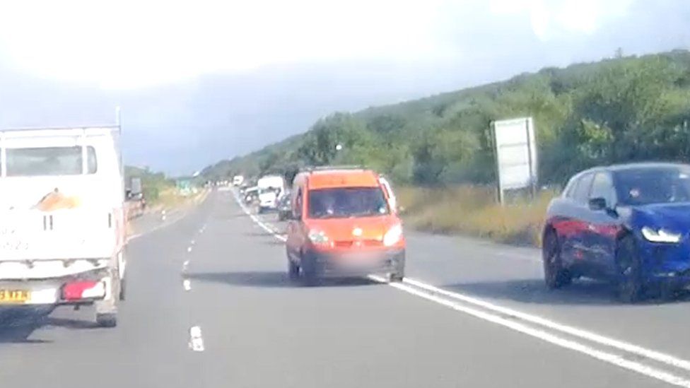 A van overtaking traffic