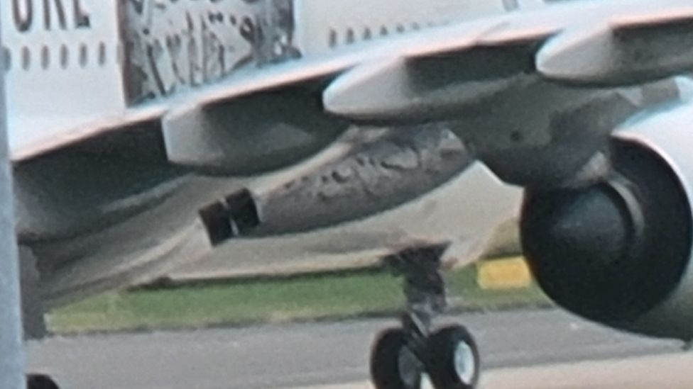 Close up of undercarriage of plane at airport